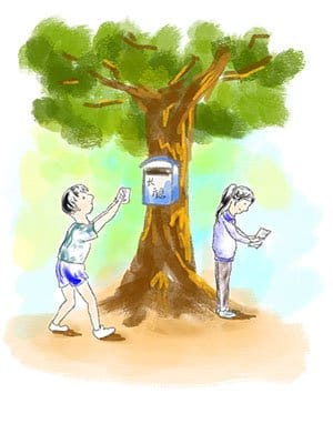 A child posting a letter into the school mailbox