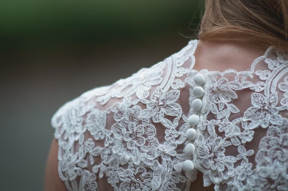 Lace buttons down the back of a dress