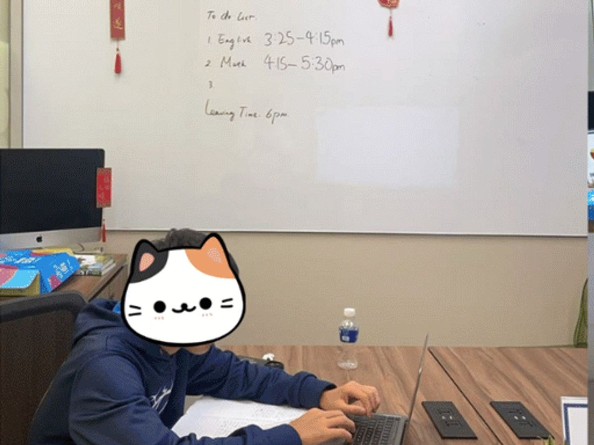 A student working at a laptop in the FE study room, beneath a whiteboard holding that afternoon's plan: English 3:25 to 4:15pm, Maths 4:15 to 5:30pm, leaving time 6pm