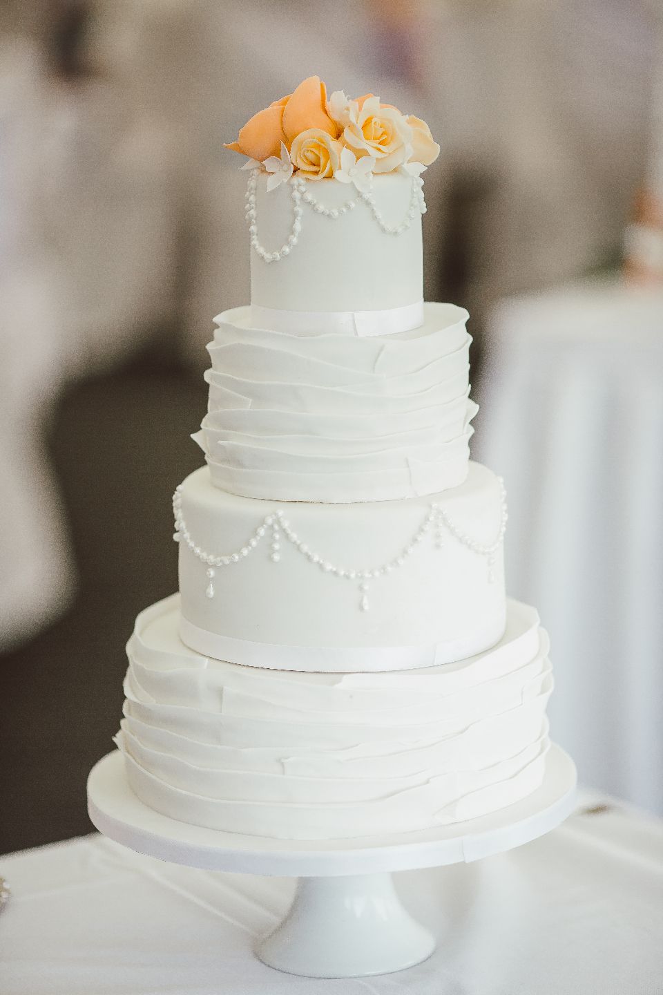 A tiered white wedding cake
