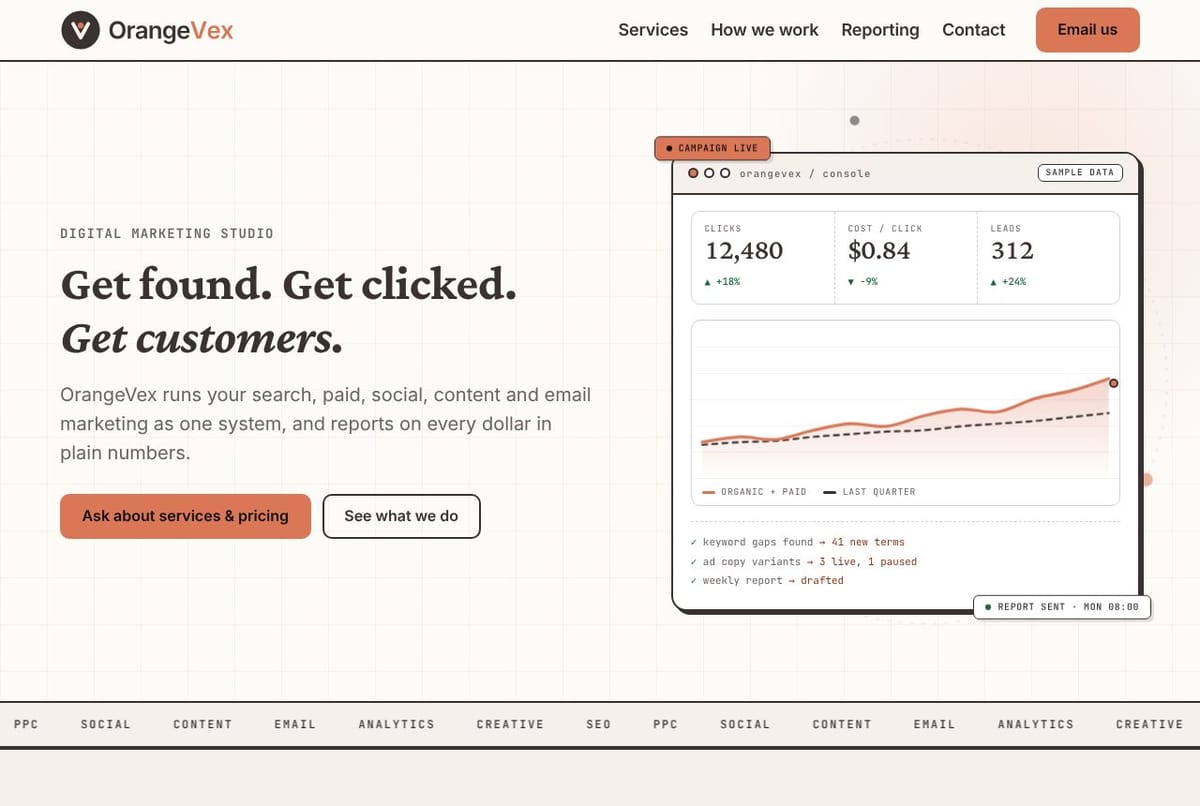The OrangeVex home page on a laptop
