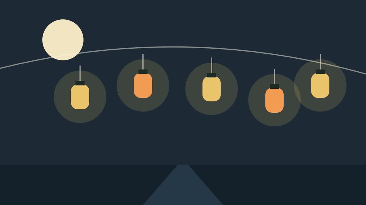 A string of glowing paper lanterns under a full moon