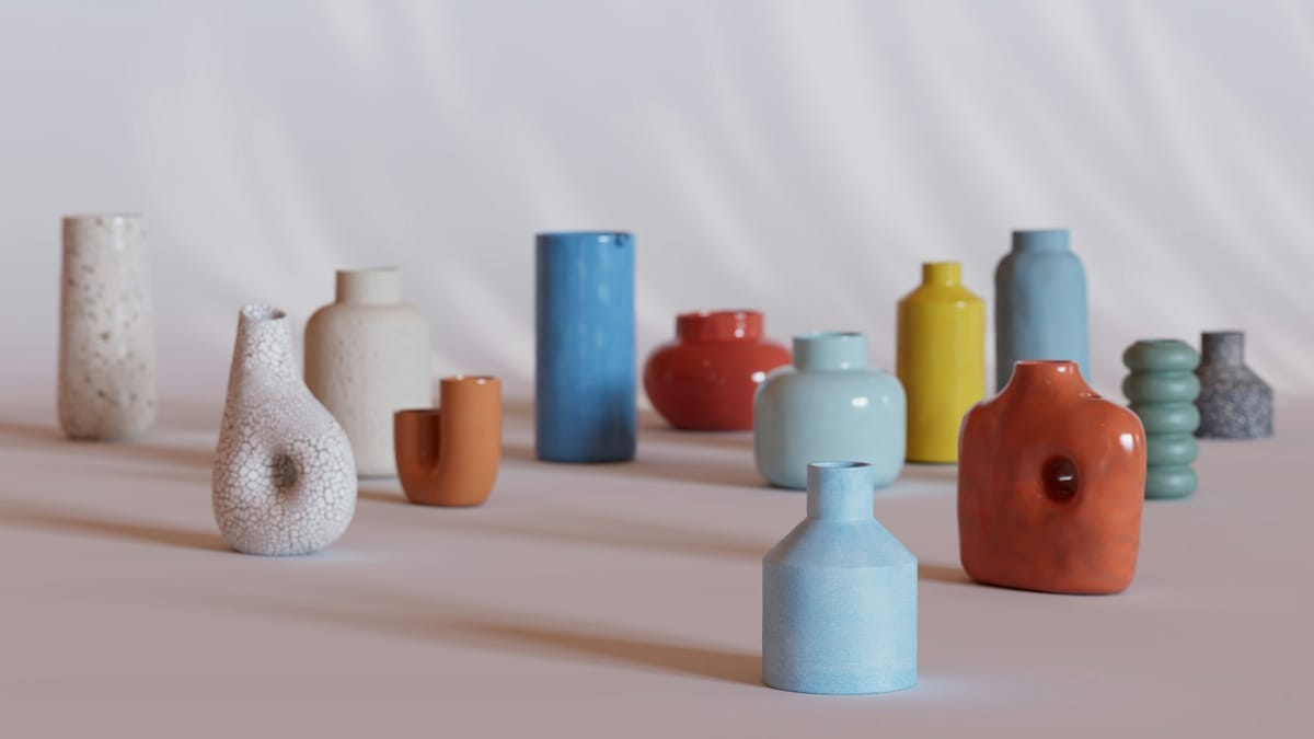 Small colored ceramic vases on a pale table